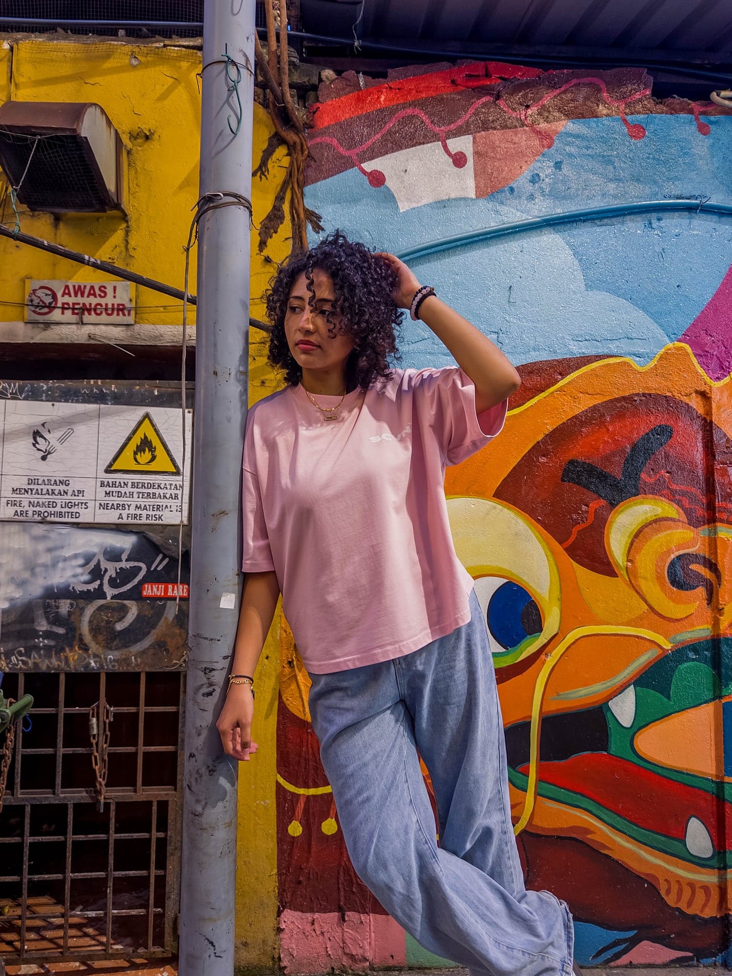 Powder heavyweight tee worn at a street corner
